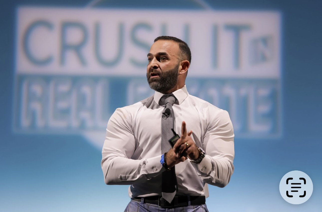 Jason Posnick speaking on stage at a real estate industry event